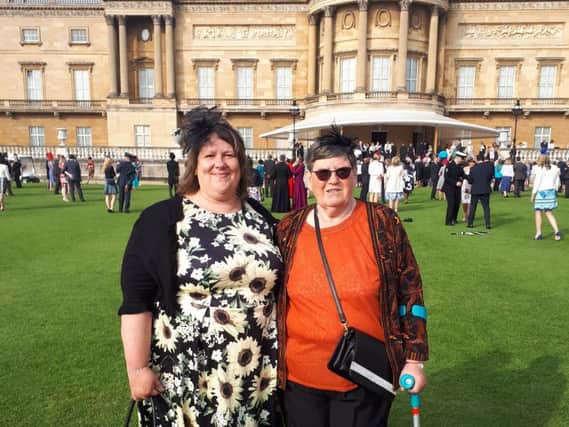 Volunteers Sharron Reynolds and Margaret Nuttall at Buckingham Palace.