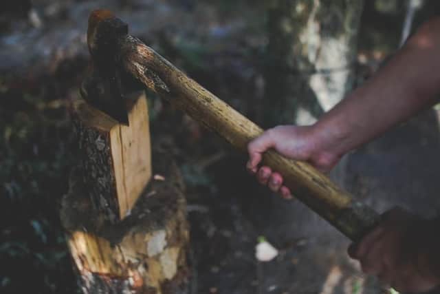 He threatened to chop the woman's toes off, break her ribs and kill her with the axe.