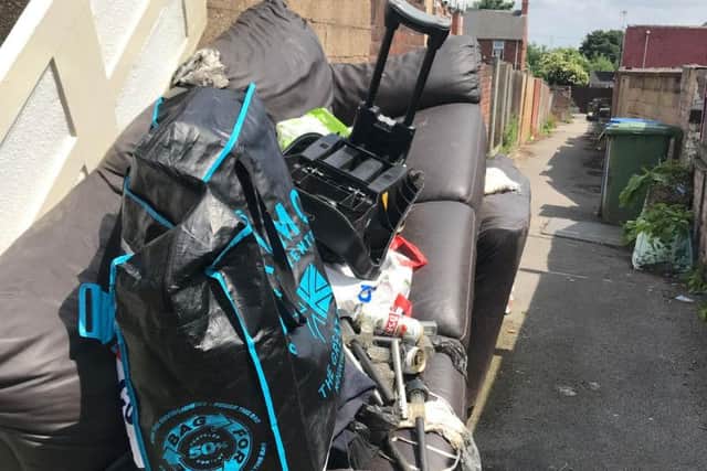 A fly tipped sofa on the street.