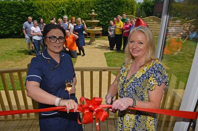 Opening of new end of life care wing at Parkside Nursing Home, Forest Town, pictured cutting the ribbon is deputy manager Sarah Milnes and manager Debbie Metcalfe