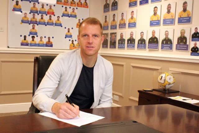 Neil Bishop signs for Stags