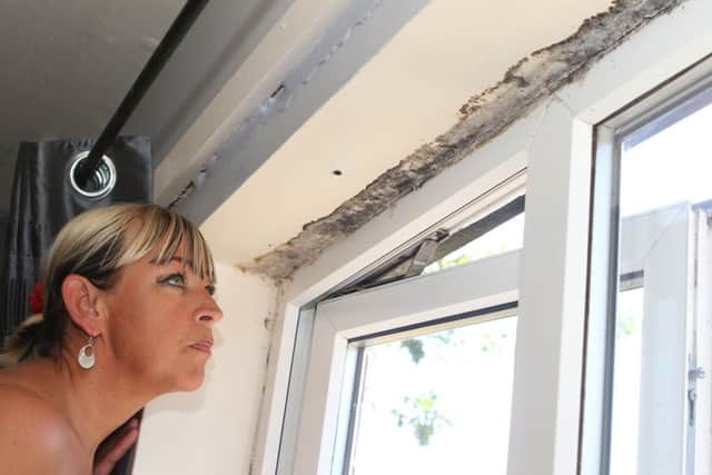 Tracey Long examines the mould in one of her bedrooms