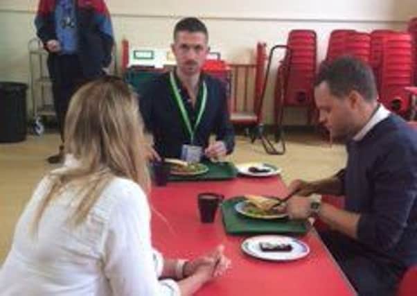 MP Ben Bradley tucks into pie and peas during a visit to the school.