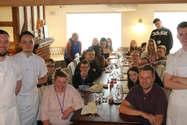 Students and tutors on their visit to The Black Bull, pictured with joint head chefs Craig Hadden and Lewis Kuciers (first and second left) and chef de partie Rees Whelpton (right).