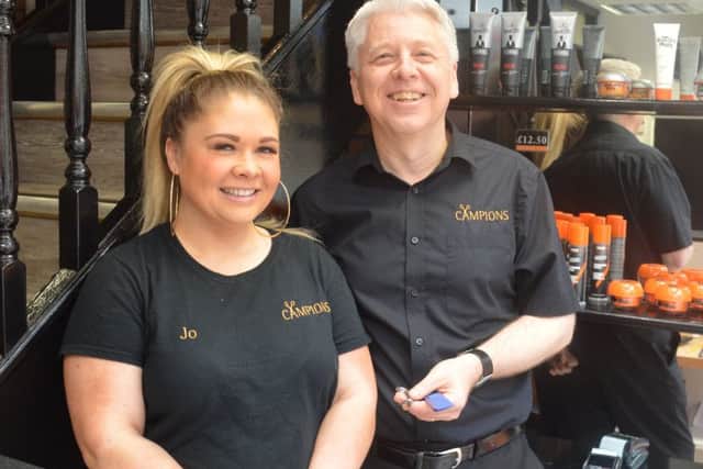 Paul Sanderson, who has risen from Saturday boy to owner at Campions Hairdressing in Mansfield, pictured with long-serving receptionist Jo Parkes.