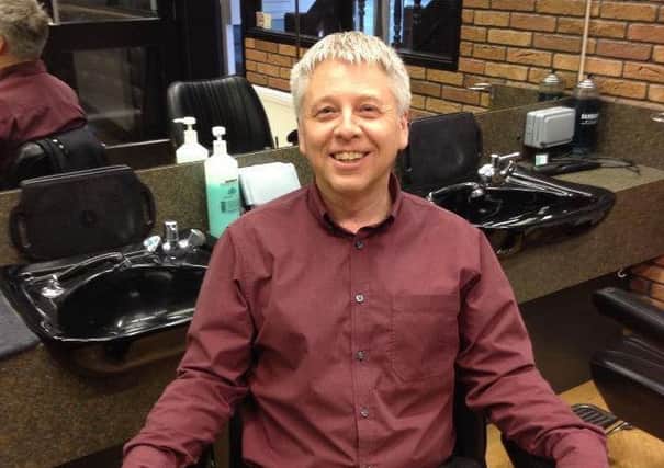 On his throne at the Campions salon -- owner Paul Sanderson.