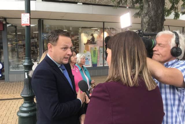 Coun Jason Zadrozny is interviewed for TV during his visit to Sutton town centre