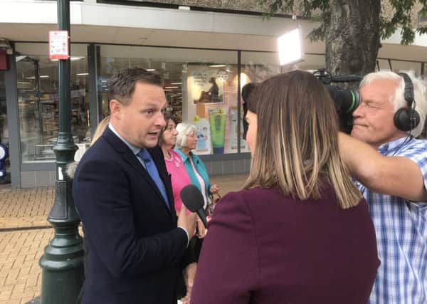 Coun Jason Zadrozny is interviewed for TV during his visit to Sutton town centre