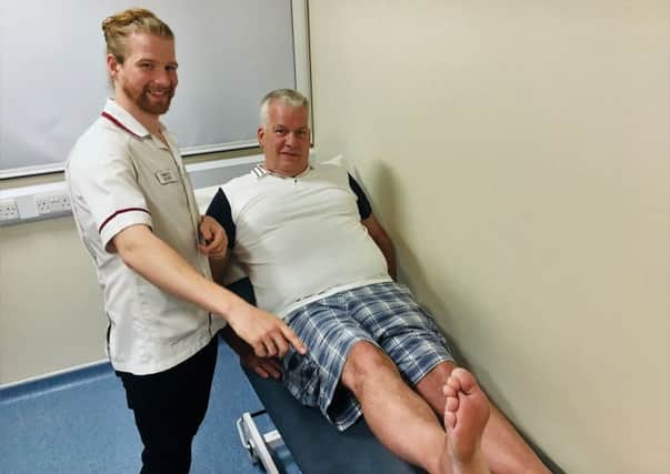 Grandad Edwin Wallace with physio Sam Smart after his operation.