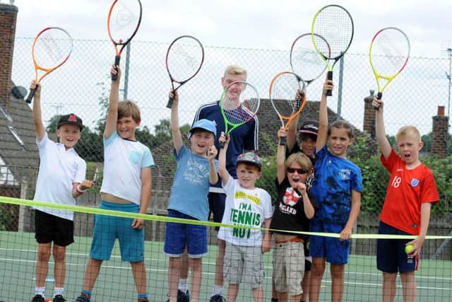 Mansfield Lawn Tennis Club free open day.   Coach Euan Burgess with some of the youngsters who attended the open day session at the Mansfield Lawn Tennis Club on Saturday.