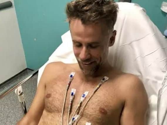 Richard Bacon in his hospital bed.