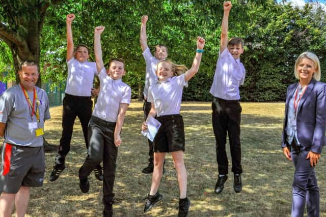 Cerys Racher (centre) celebrates her prize with her friends and Gary Shaw (community manager and PL Primary Stars co-ordinator at Mansfield Town) and Louise Hamby (Teachers UK)