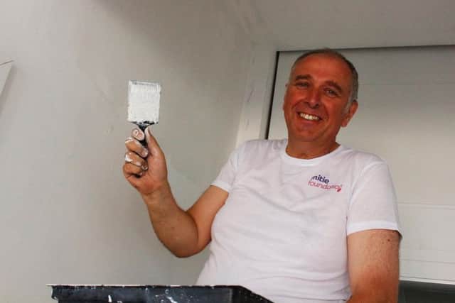 Principal Mark Dale lending a hand with the painting.