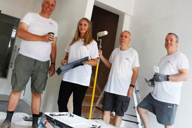 Mark Dale with volunteer Tracey Horton, assistant principal Ian Cowin and a volunteer from MITE.