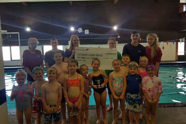 Splash Dance swimmers with their cheque for Nottingham Children's Hospital