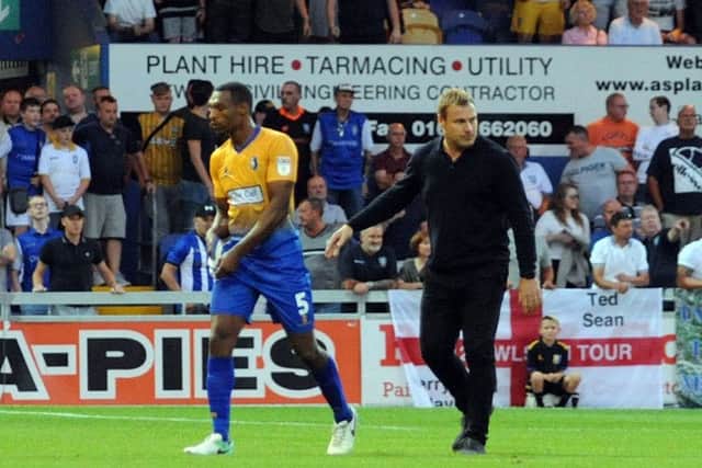 Mansfield Town v Sheffield Wednesday.Krystian Pearce is lead away from trouble at the end of the game.