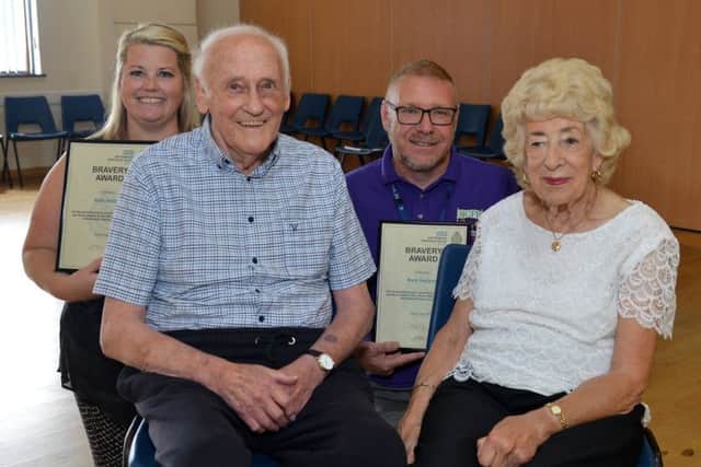 Cardiac arrest survivor Alan Moore is reunited with paramedics and bystanders who saved his life when he collapsed at a dance class, Alan is Pictured with his wife Pamela support worker Kelly Ashley and childrenâ¬"s Centre co-ordinator Mark Hoyland who performed CPR before the paramedics arrived