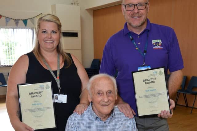 Cardiac arrest survivor Alan Moore is reunited with paramedics and bystanders who saved his life when he collapsed at a dance class, Alan is Pictured support worker Kelly Ashley and childrenÃ¢Â¬"s Centre co-ordinator Mark Hoyland who performed CPR before the paramedics arrived