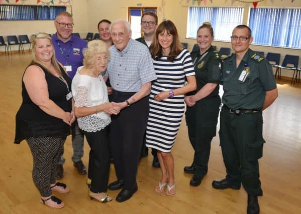 Cardiac arrest survivor Alan Moore is reunited with paramedics and bystanders who saved his life when he collapsed at a dance class, Alan is Pictured with his wife Pamela, daughter Joanne Waklin, support worker Kelly Ashley, childrenÃ¢Â¬"s Centre co-ordinator Mark Hoyland who performed CPR before the paramedics arrived and paramedics