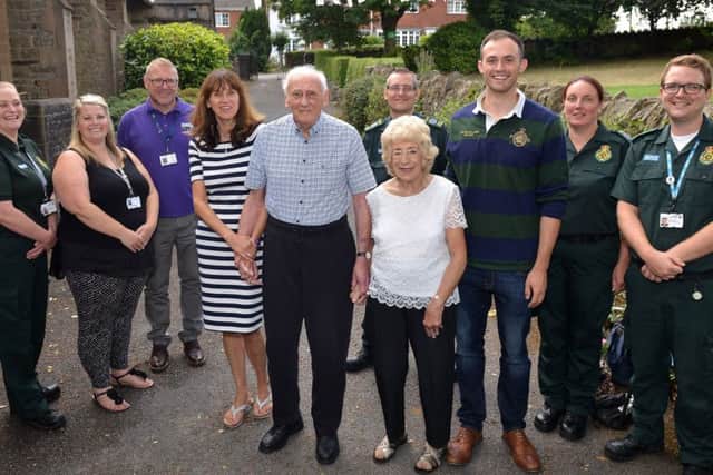 Cardiac arrest survivor Alan Moore is reunited with paramedics and bystanders who saved his life when he collapsed at a dance class, Alan is Pictured with his wife Pamela, daughter Joanne Wakelin. Grandson Luke Wakelinsupport worker Kelly Ashley and childrenâ¬"s Centre co-ordinator Mark Hoyland and paramedics