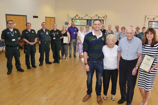 Cardiac arrest survivor Alan Moore is reunited with paramedics and bystanders who saved his life when he collapsed at a dance class, Alan is Pictured with his wife Pamela, Daughter Joanne Wakelin and grandson Luke Wakelin