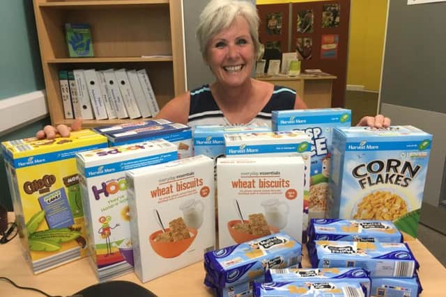 Yvonne Hudson, with her donation to the foodbank.