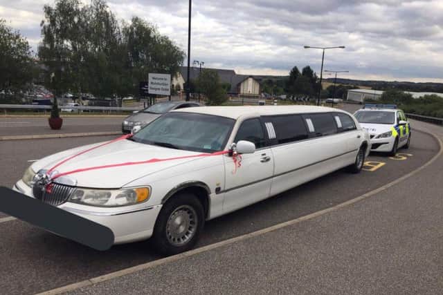 The limo outside the designer outlet.