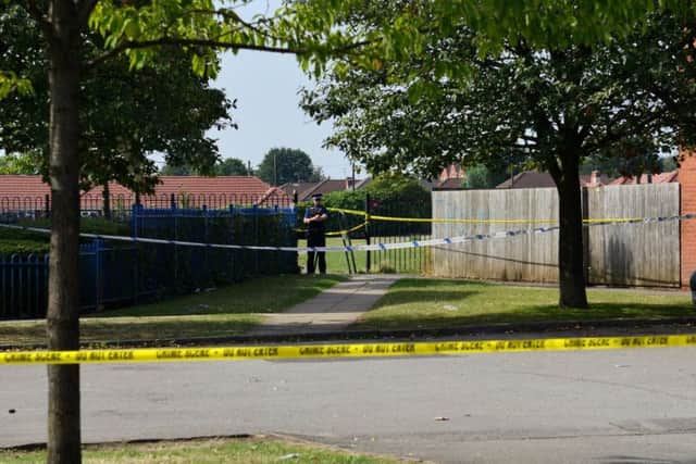 A parking area was taped off by police.