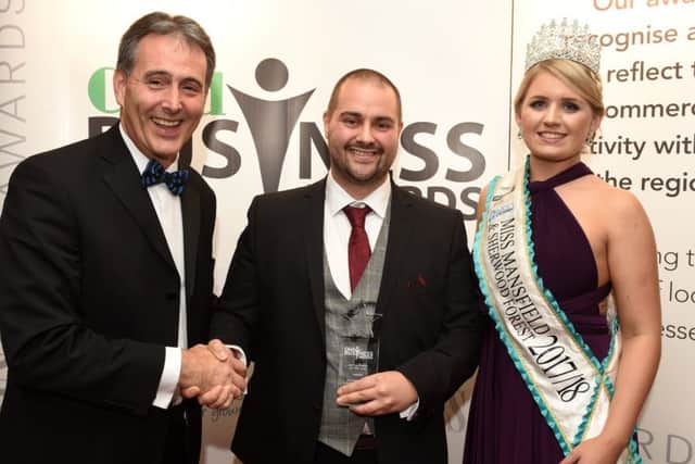 Director Sean O'Connor receives the best business award last year from Gev Lynott, of Mansfield Building Society, and Miss Mansfield and Sherwood Forest, Jessica Pinnick.
