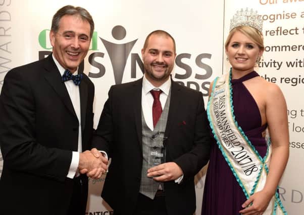 Director Sean O'Connor receives the best business award last year from Gev Lynott, of Mansfield Building Society, and Miss Mansfield and Sherwood Forest, Jessica Pinnick.