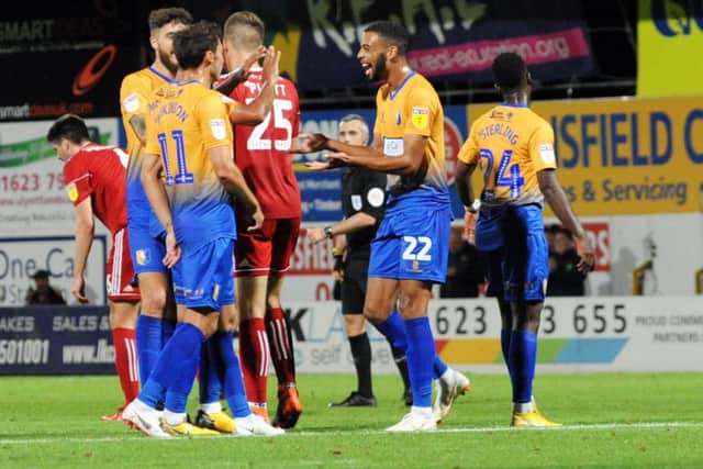 Mansfield Town v Accrington Stanley. CJ Hamilton is all smiles after getting on the score sheet.