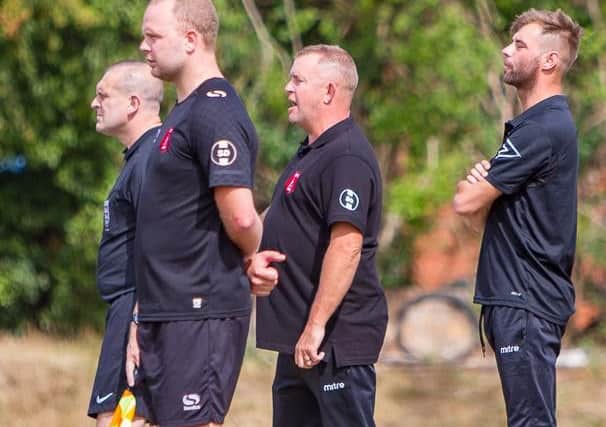 Micky Taylor (second from right) was thrilled to see his side win in their FA Cup tie.