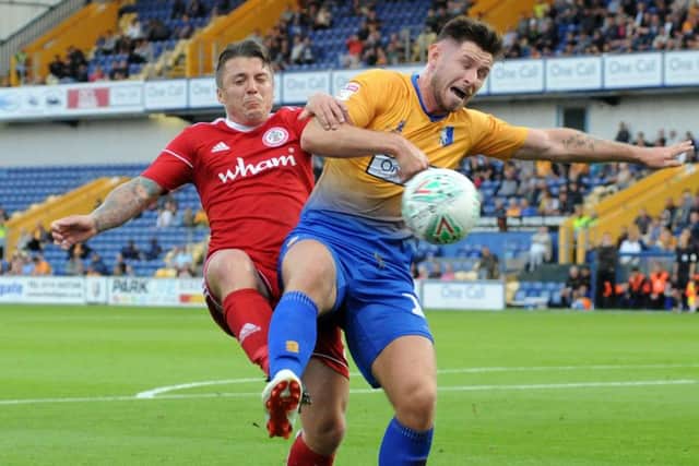 Mansfield Town v Accrington Stanley.Mansfield's second penalty is awarded after this challenge in the first half.