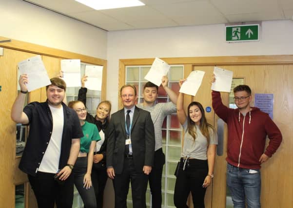 A level students at Brunts academy celebrate their results.