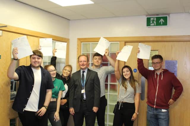 A level students at Brunts academy celebrate their results.