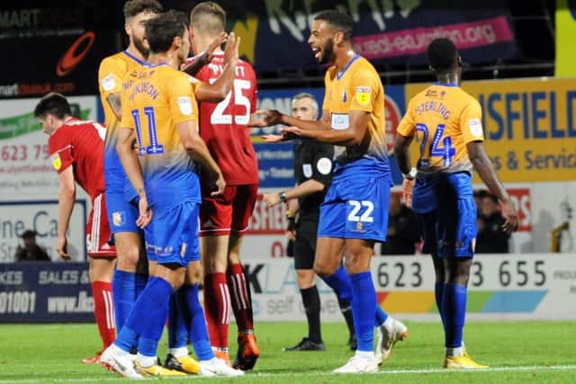 Mansfield Town v Accrington Stanley. CJ Hamilton is all smiles after getting on the score sheet.