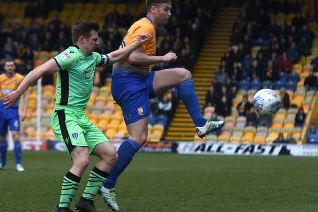 Picture Andrew Roe/AHPIX LTD, Football, EFL Sky Bet League Two, Mansfield Town v Colchester United, One Call Stadium, 10/03/18, K.O 3pmMansfield's Joel Byrom battles with Colchester's Tom LapslieAndrew Roe>>>>>>>07826527594