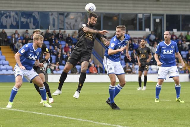 Mansfield Town's Craig Davies heads the ball: Picture by Steve Flynn/AHPIX.com, Football: Sky Bet League Two match Macclesfield Town -V- Mansfield Town at Moss Rose, Macclesfield, Cheshire, England copyright picture Howard Roe 07973 739229