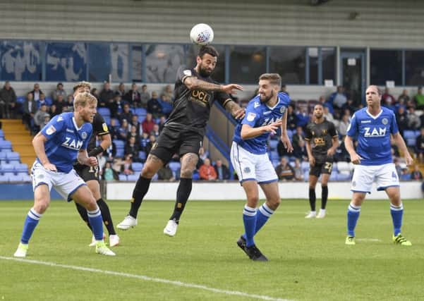 Mansfield Town's Craig Davies heads the ball: Picture by Steve Flynn/AHPIX.com, Football: Sky Bet League Two match Macclesfield Town -V- Mansfield Town at Moss Rose, Macclesfield, Cheshire, England copyright picture Howard Roe 07973 739229