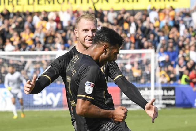 Mansfield Town's Neal Bishop celebrates with goal scorer Malvind Benning as Town go 1-0 up: Picture by Steve Flynn/AHPIX.com, Football: Sky Bet League Two match Macclesfield Town -V- Mansfield Town at Moss Rose, Macclesfield, Cheshire, England copyright picture Howard Roe 07973 739229