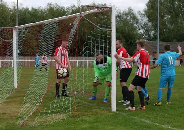 The ball lands in the net for the first goal of Julian Toplisss hat-trick. (PHOTO BY: Mark Asher)