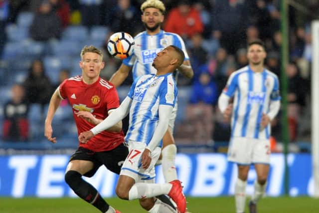 Rajiv van La Parra holds the ball frm Scott McTominay. Huddersfield Town v Manchester United.  Emirates FA Cup 5th Round.  John Smiths Stadium. 17 February 2018.  Picture Bruce Rollinson