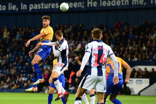 Picture by Howard Roe/AHPIX.com;Football;Skybet;Carabao Cup; Round 2West Bromwich Albion v Mansfield Town28/8/2018  KO 8.00 pm; The Hawthorns;copyright picture;Howard Roe;07973 739229Stag's Ryan Sweeney heads the ball back into the Baggies box