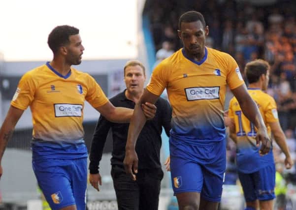 Mansfield Town v Sheffield Wednesday.
Krystian Pearce is lead away from trouble at the end of the game.