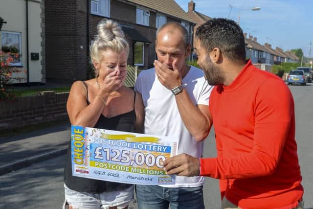 Peoples Postcode Lottery winners from Mansfield NG19 6QQ  All images cleared for release. Shown being presented with his winning cheque from Danyl Johnson is Alan Kemp and wife Lisa.  Â©Darren Casey 07989 984643 No Syndication without prior arrangement.