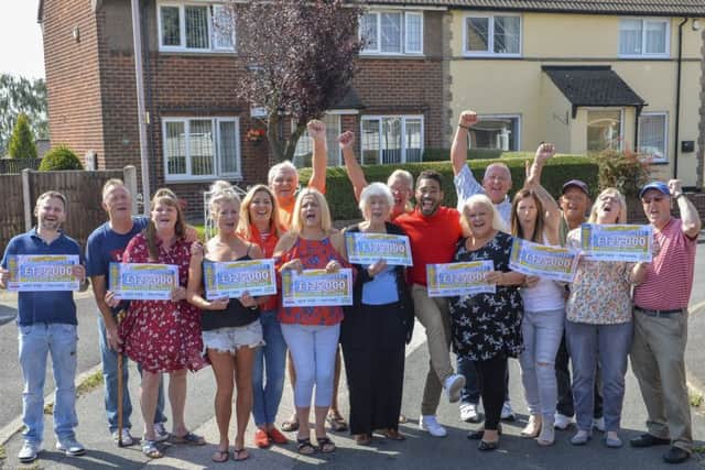 Peoples Postcode Lottery winners from Mansfield NG19 6QQ  All images cleared for release. Shown with their winning cheques are all the lucky neighbours from Bonington Road.  Â©Darren Casey 07989 984643 No Syndication without prior arrangement.