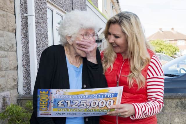 Peoples Postcode Lottery winners from Mansfield NG19 6QQ  All images cleared for release. Shown being presented with her winning cheque from Judie McCourt is Margaret Bowler  Â©Dustin Smith No Syndication without prior arrangement.