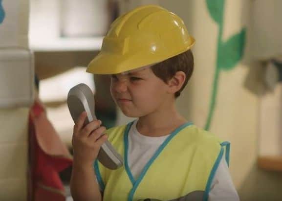 One of the young actors looks annoyed with a phone call to his accountant.