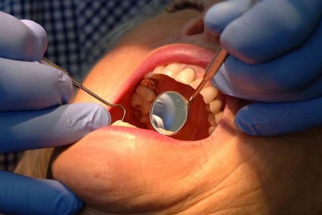 The number of people taking up free NHS dental treatments has dropped