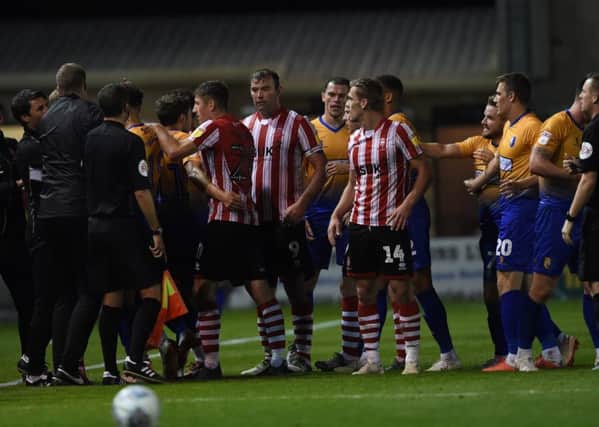 Stags and Imps get involved after Michael O'Connor brought down Calum Butcher